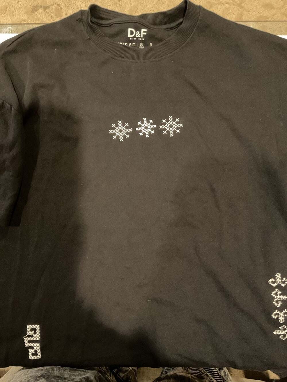 D&F Black T-Shirt with White Cross-Stitch Snowflake Embroidery